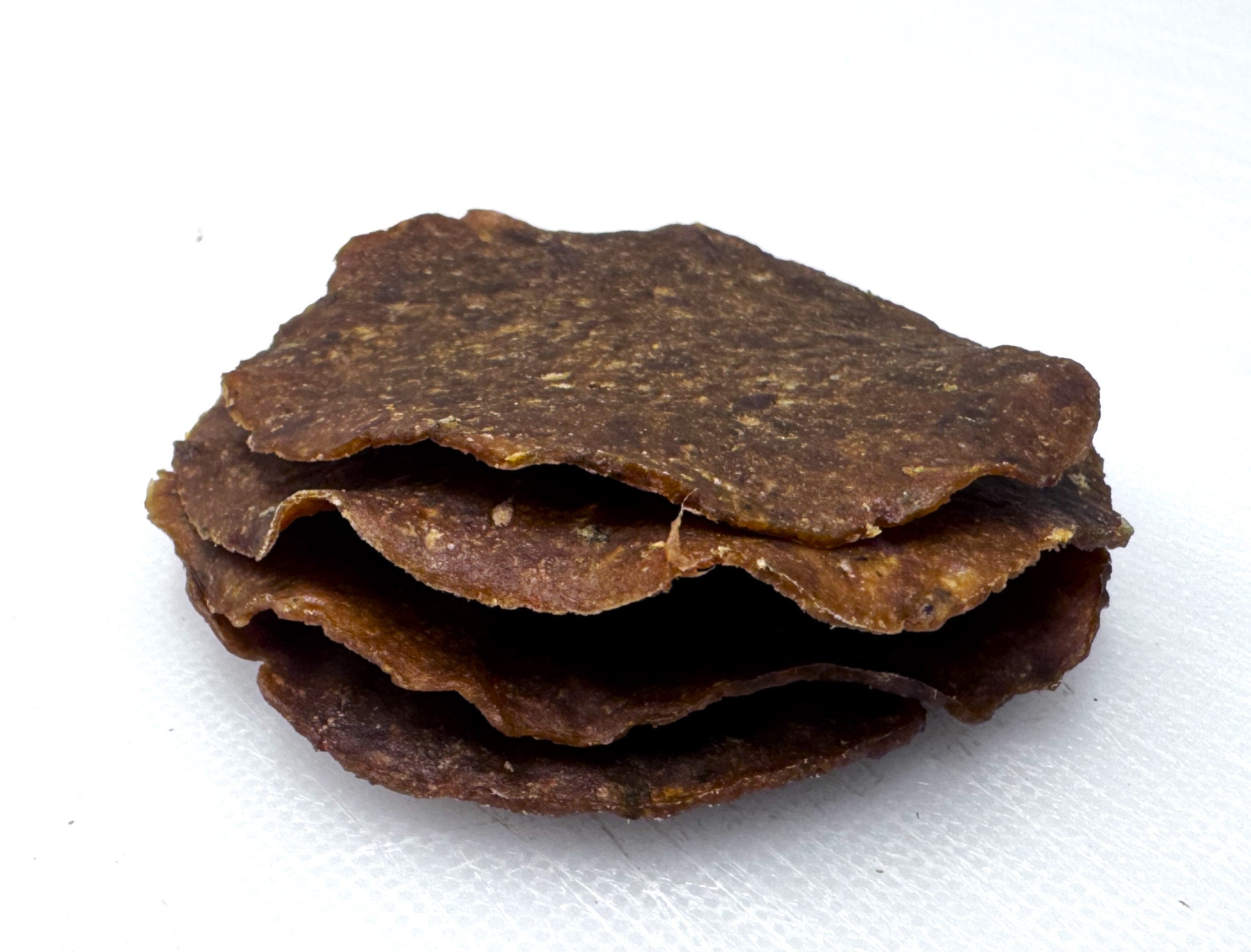 A photo of a hybrid jerky with meat and nutritional yeast 
