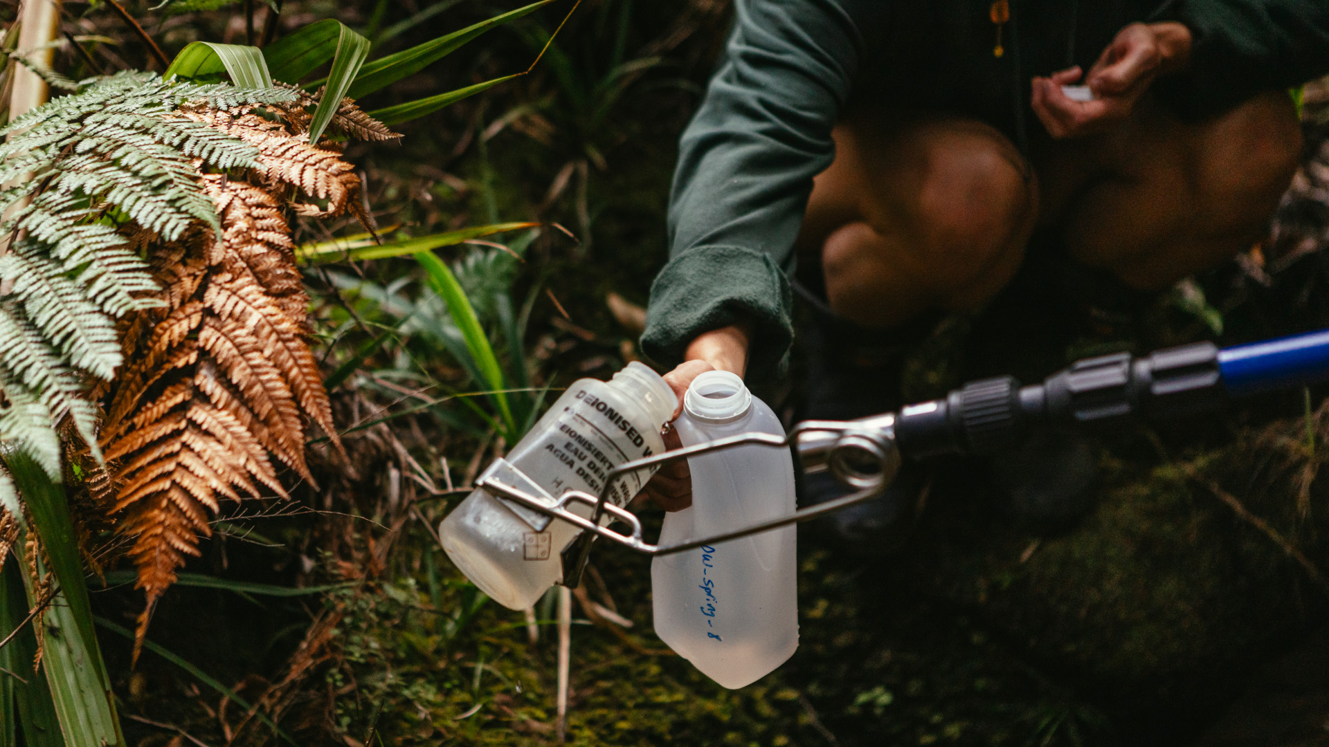 Renee Raroa and her son Awatere Richardson collecting eDNA samples